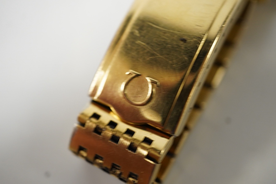 A gentleman's steel and gold plated Omega automatic wrist watch, with baton numerals and date aperture, on a steel and gold plated Omega bracelet, case diameter 35mm, box, no papers. Condition - fair